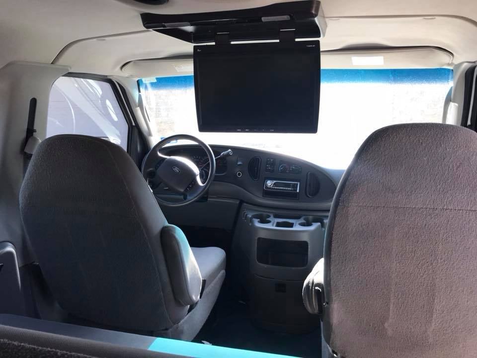 "There's a 20" TV mounted to the ceiling. It works and is connected to an in-dash DVD player. This is a handy feature as it helps distract kids from the intermittent air conditioning and smell of decaying chicken nuggets."