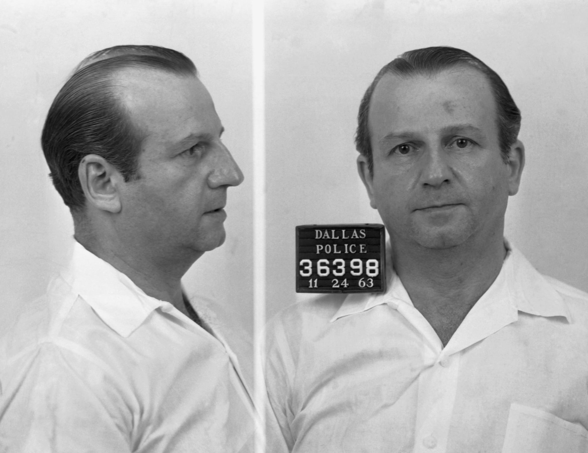On November 24, 1963, Jack Ruby was arrested for murdering Lee Harvey Oswald, who had been arrested on charges of assassinating President Kennedy and murdering a Dallas police officer two days earlier. (Photo by © CORBIS/Corbis via Getty Images)