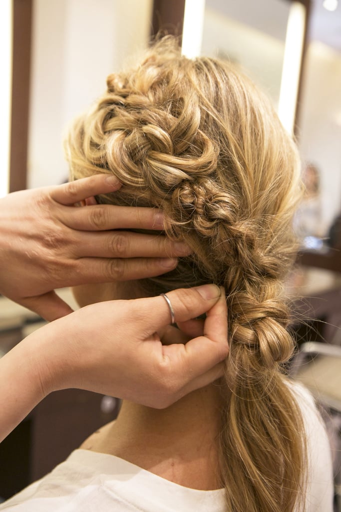 Bring the knotted hair up and connect it with the braid on the left side and pin it in place.