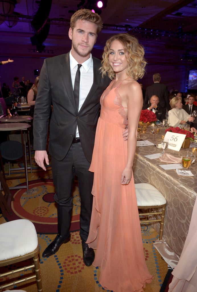 Miley Cyrus and Liam Hemsworth stuck together at Muhammad Ali's Celebrity Fight Night in March 2012.