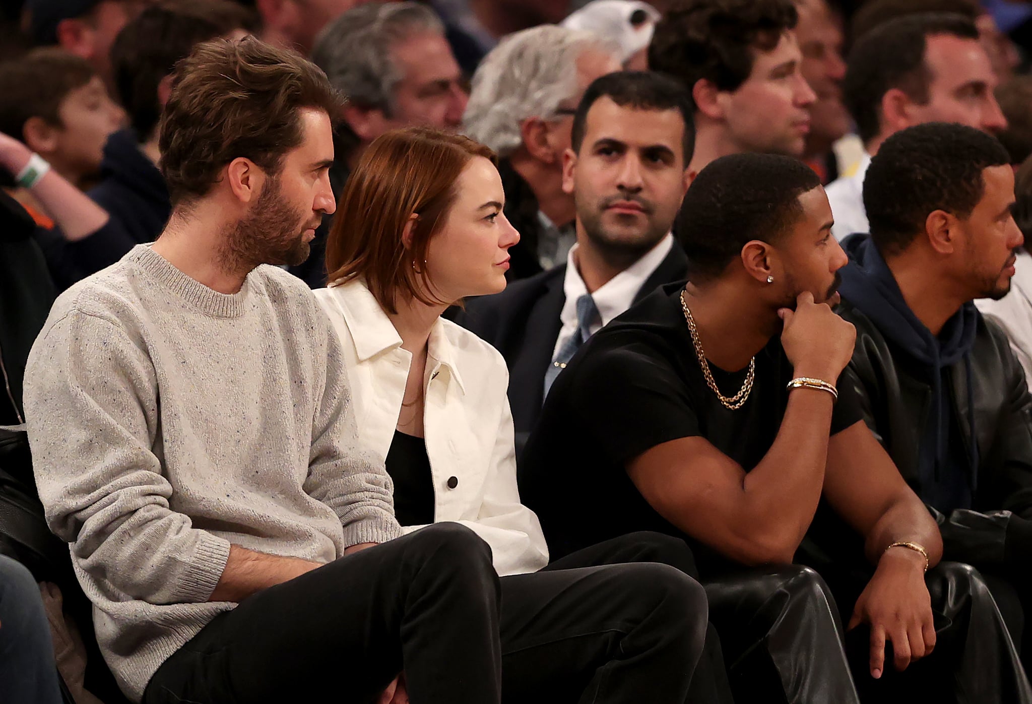 NEW YORK, NEW YORK - JANUARY 31: Dave McCary, Emma Stone and Michael B. Jordan attend the game between the New York Knicks and the Los Angeles Lakers at Madison Square Garden on January 31, 2023 in New York City. The Los Angeles Lakers defeated the New York Knicks 129-123 in overtime. NOTE TO USER: User expressly acknowledges and agrees that, by downloading and or using this photograph, User is consenting to the terms and conditions of the Getty Images License Agreement. (Photo by Elsa/Getty Images)