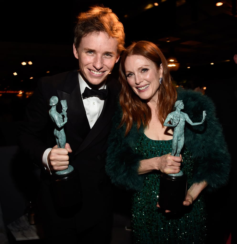 Eddie Redmayne and Julianne Moore showed off their statues.