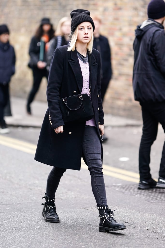 A pair of black skinny jeans is just the thing your city slicker look needs this fall, pairing the denim bottom with moto boots, a mid-length coat, beanie, and more.
