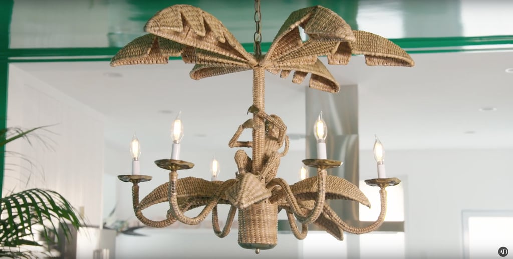 Can we please discuss the gloriousness of this rattan chandelier, complete with a little monkey?