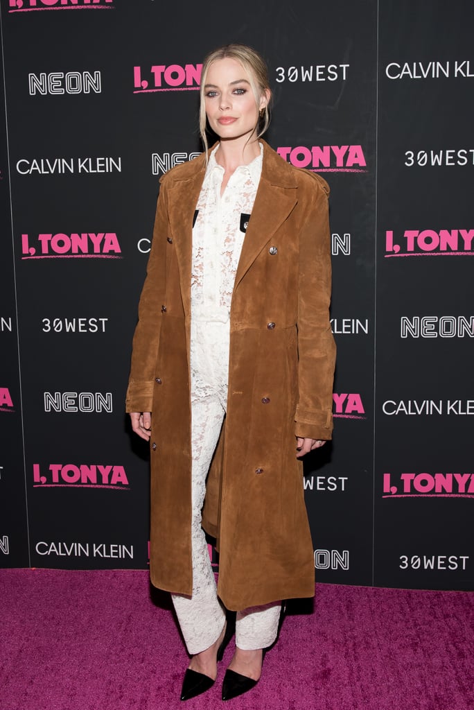 Margot wore a daring Calvin Klein ensemble consisting of sheer lace and a suede trench at the I, Tonya New York premiere in November 2017.
