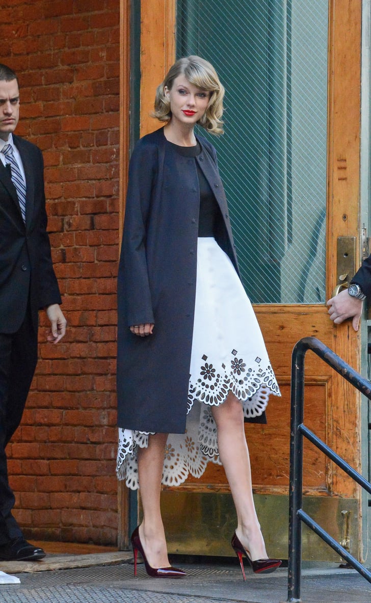 Now this is how to wear a coat over a fancy dress. Taylor Swift's