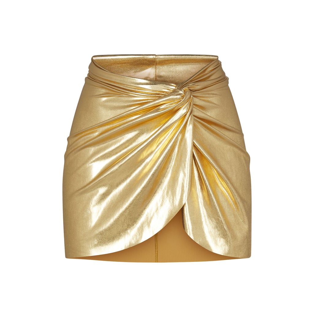 Skims Metallic Swim Sarong Mini Skirt in Gold ($78)