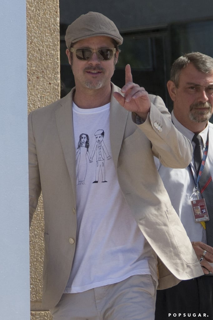 Brad Pitt Wears Homemade Shirt at Airport in France | Photos