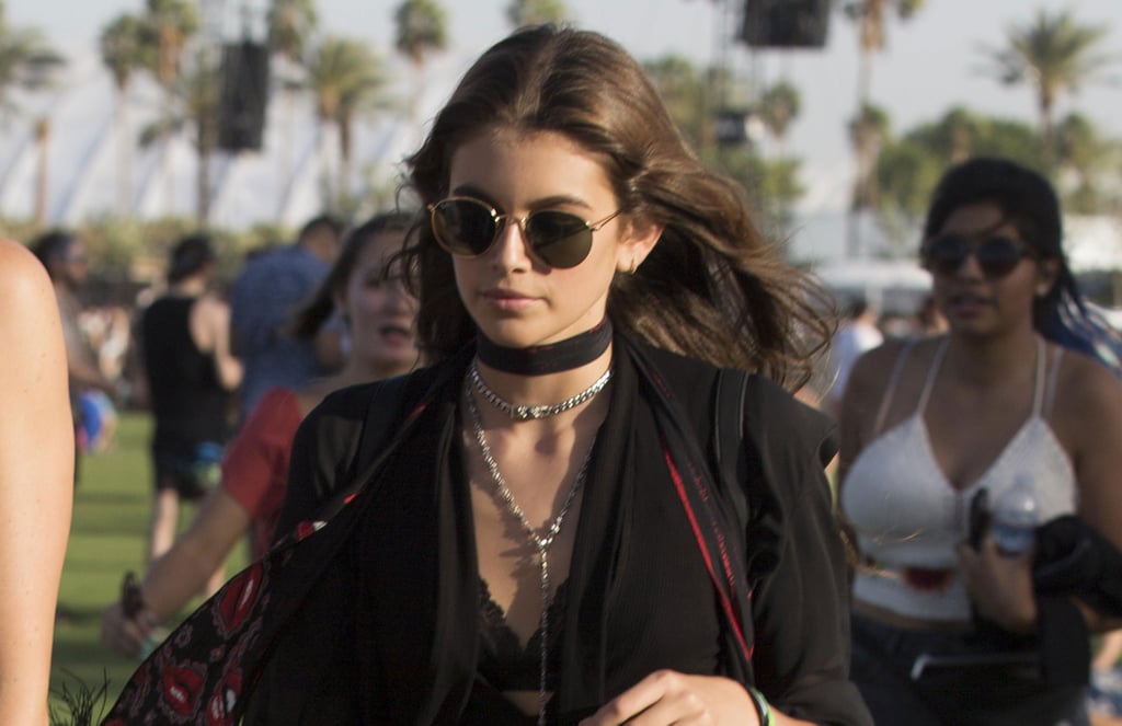 She accessorized with perfect festival flair, like a choker necklace layered with a longer chain, and finished with a scarf and shades.