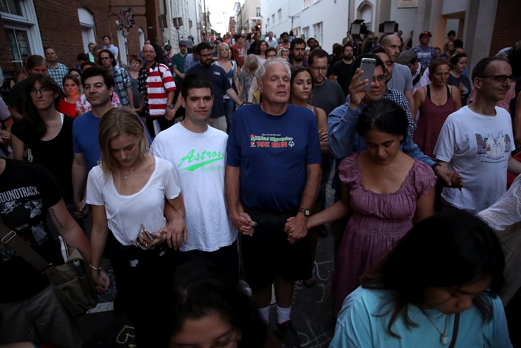 . . . and held hands at the vigil.