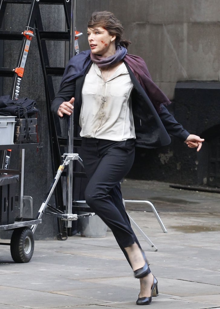 Milla Jovovich was on the move as an embattled State Department employee on the set of Survivor in London on Monday.