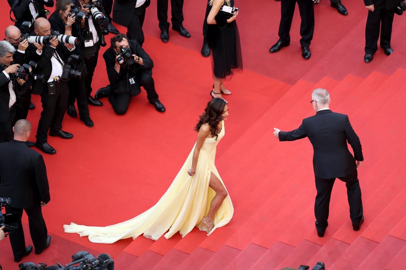 Amal Clooney Made Use of the Leg Slit on Her Atelier Versace Gown as She Climbed the Stairs