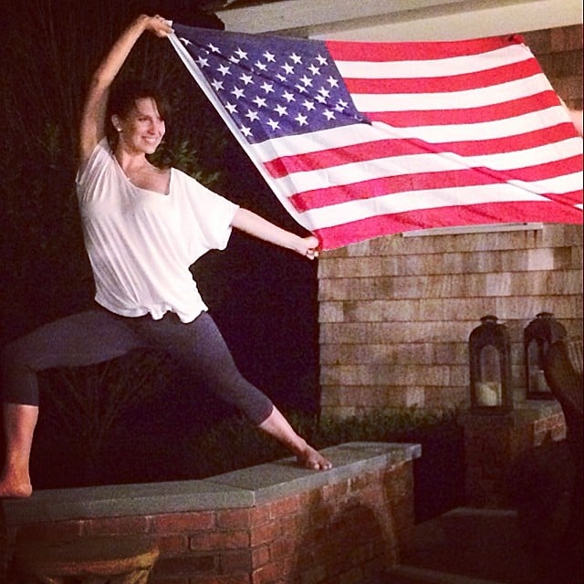 Hilaria Baldwin showed off her yoga skills with a giant flag.
Source: Instagram user hilariabaldwin