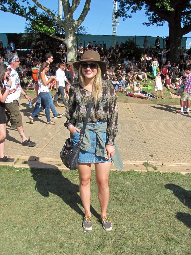 We loved the way this festivalgoer styled her of-the-moment denim skirt with a floaty top and chic hat.
