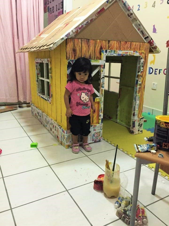 Grandfather Makes Cardboard Playhouse From Cardboard Boxes