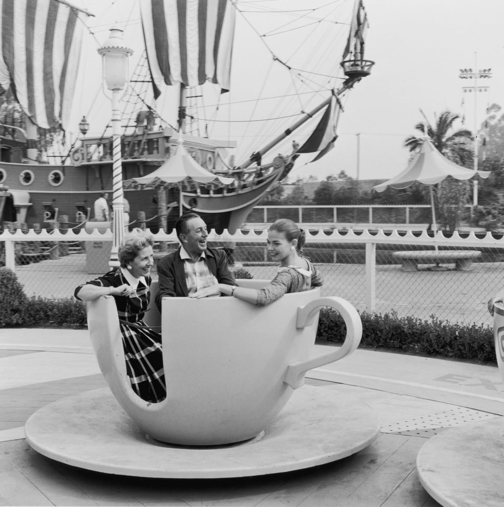 Walt Disney, his wife, Lillian, and their daughter, Diane, take a family ride in the famous teacups at Disneyland.