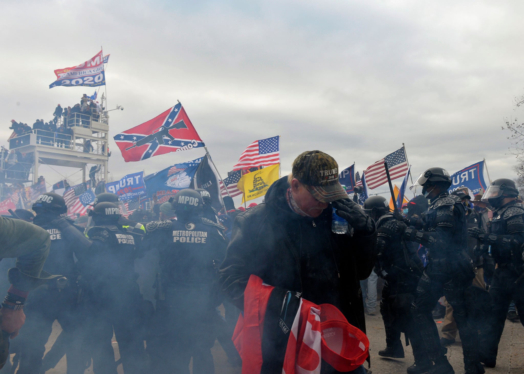 Trump supporters clash with police and security forces as people try to storm the US Capitol Building in Washington, DC, on January 6, 2021. - Demonstrators breeched security and entered the Capitol as Congress debated the a 2020 presidential election Electoral Vote Certification. (Photo by Joseph Prezioso / AFP) (Photo by JOSEPH PREZIOSO/AFP via Getty Images)