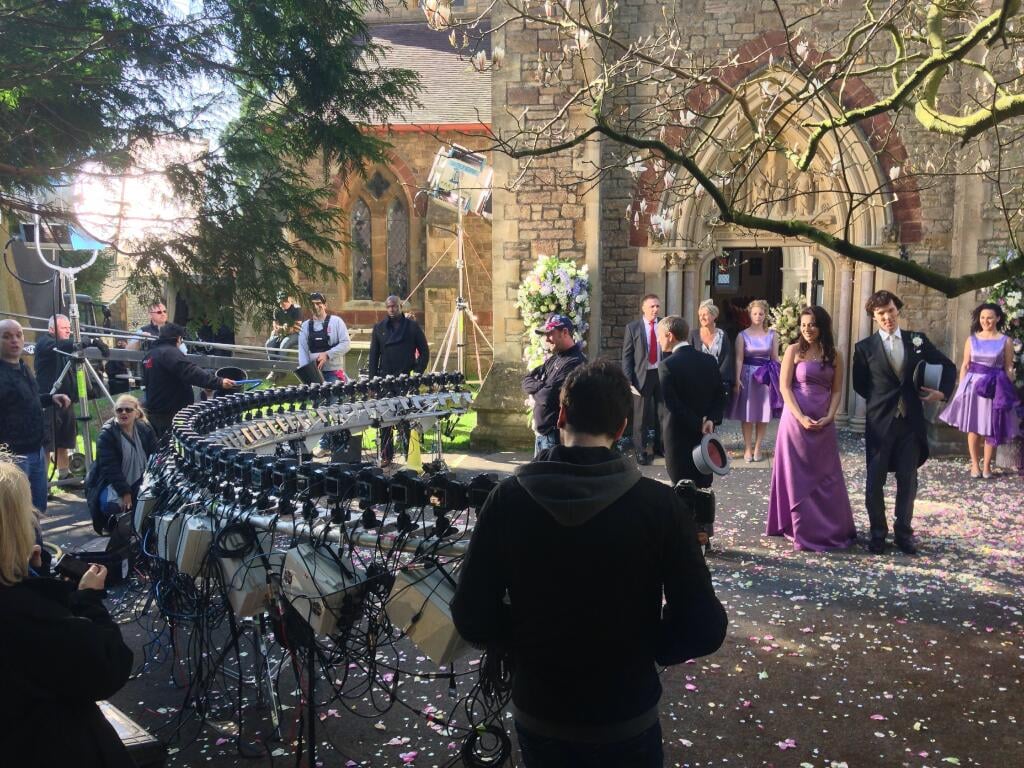 "What do you mean you didn't press the shutter!" From Steve Lawes, director of photography on the second episode, "The Sign of Three," with a totally different perspective on the flashing cameras when Watson and Mary emerge from the church on their wedding day. 
Source: Twitter user SteveLawes