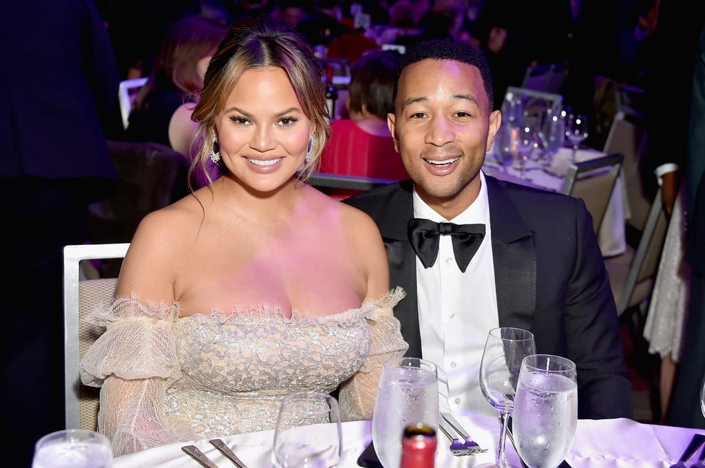 Chrissy Teigen Wearing Cream Off-the-Shoulder Gown