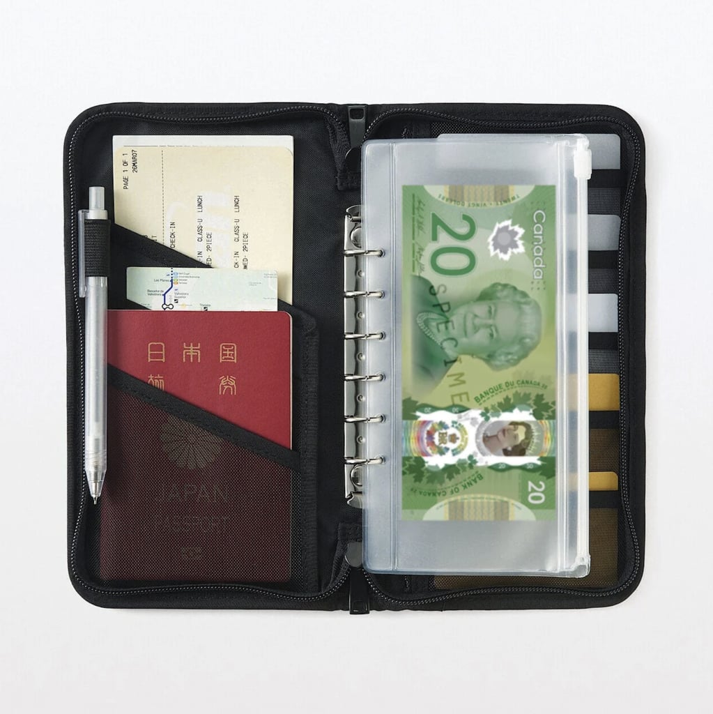 Muji Passport Case With Pocket ($12, originally $24)
I currently have a billfold-style wallet for my passport, but have been in need of an upgrade, and this pouch is perfect for just that. I love the clear pouch for cash, holder for a pen, and multiple slots for credit cards.