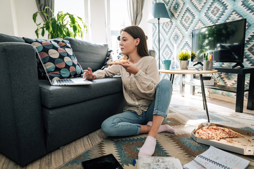Young woman at home, working and studying from home