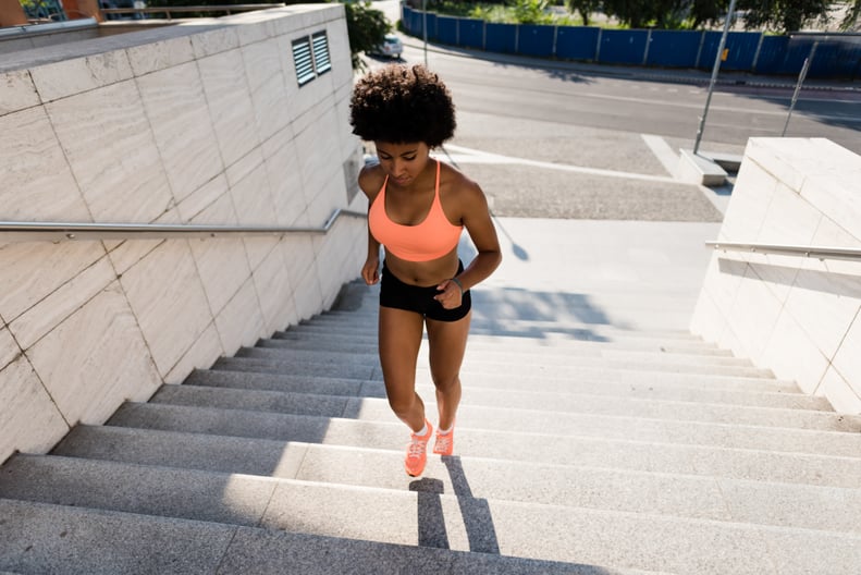 Healthy lifestyle sports woman running on stairway
