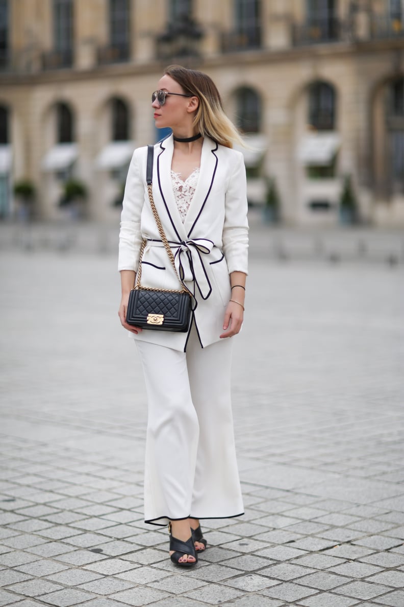 A white pyjama suit with contrast piping