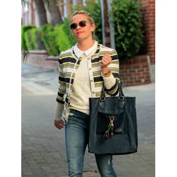 Reese Witherspoon totes her custom- monogrammed designer bag