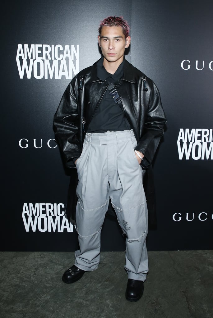 Attending an event in high-waisted trousers with a leather jacket.