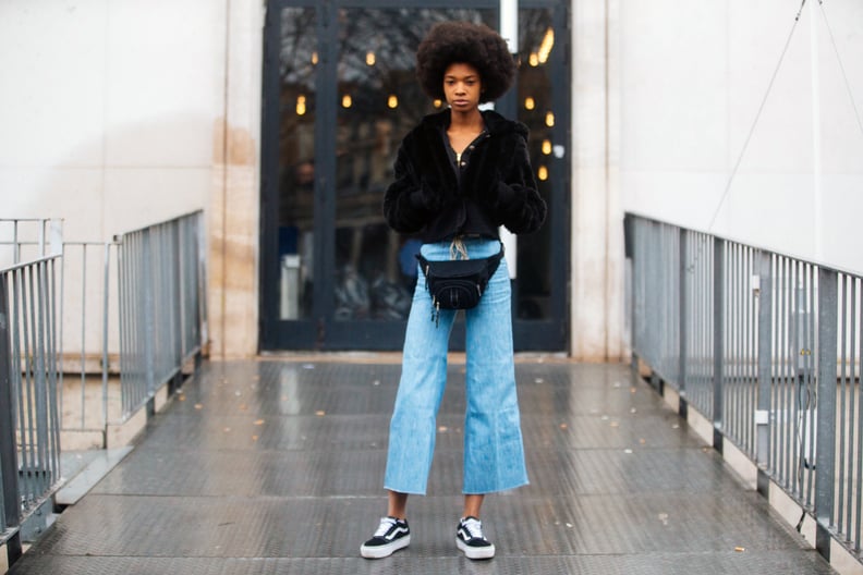 With a Cropped Fur Jacket, Fanny Pack, and Flared Jeans