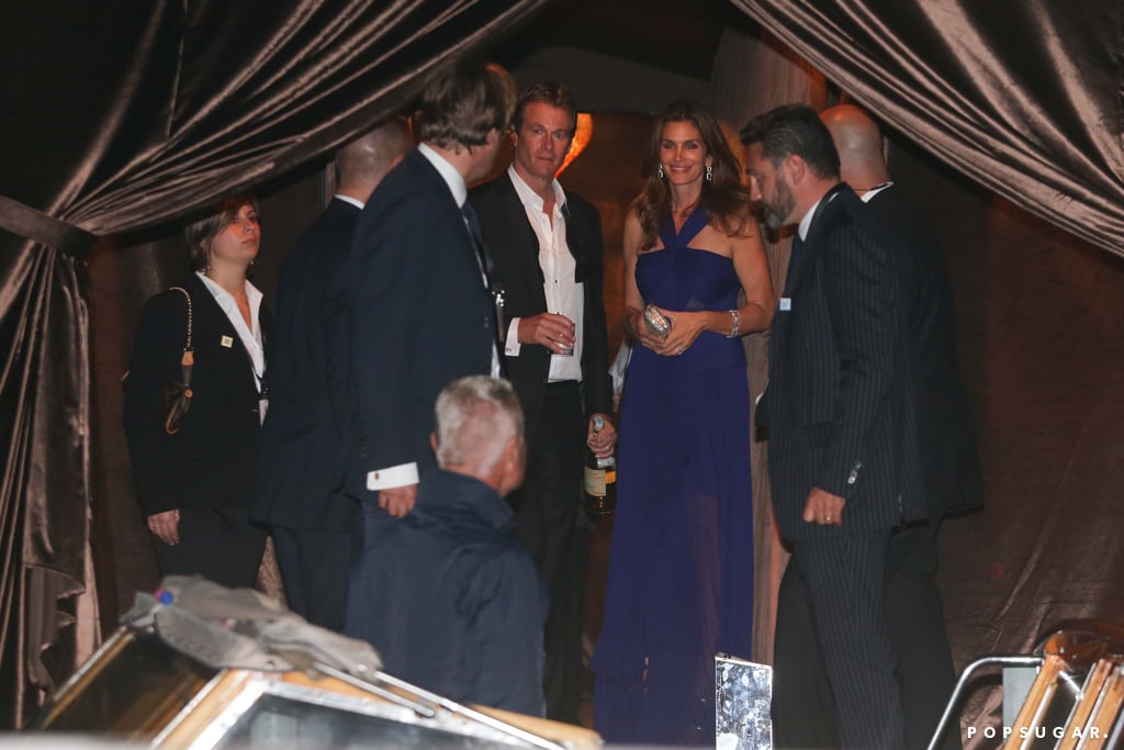 Rande Gerber held a bottle of Casamigos Tequila as he and Cindy Crawford left the reception.