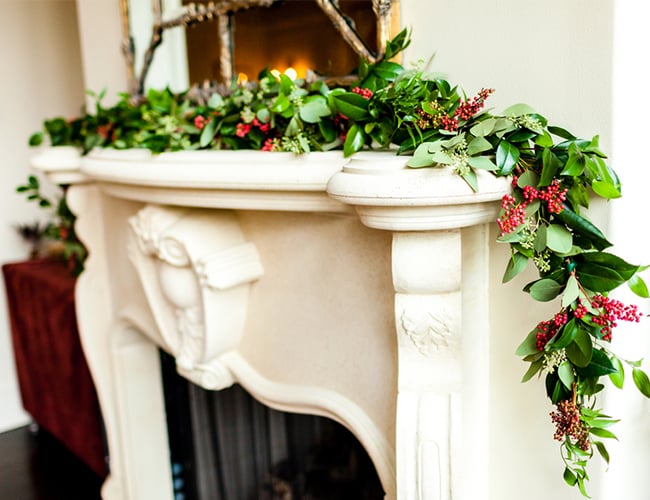 Sitting by the fireplace.