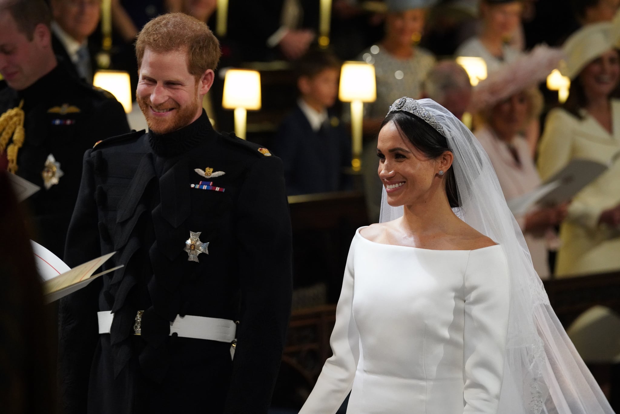 Britain's Prince Harry, Duke of Sussex, (L) and US fiancee of Britain's Prince Harry Meghan Markle arrive at the High Altar for their wedding ceremony in St George's Chapel, Windsor Castle, in Windsor, on May 19, 2018. (Photo by Jonathan Brady / POOL / AFP)        (Photo credit should read JONATHAN BRADY/AFP/Getty Images)