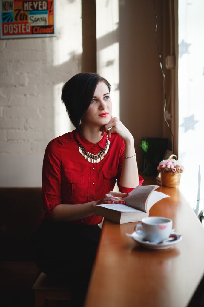 Read a romance novel in a cafe.