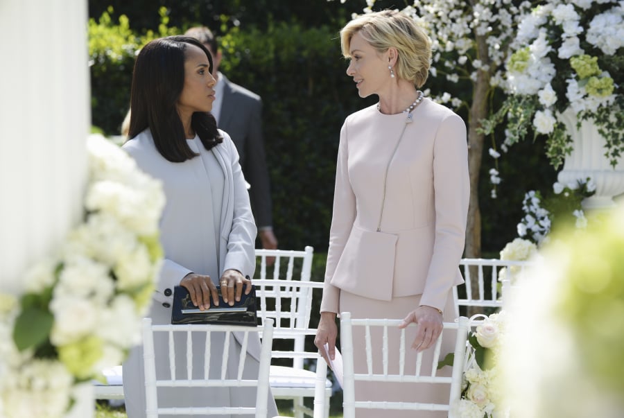 We'd never think to wear a pastel set to a wedding, but these two sure are working it.