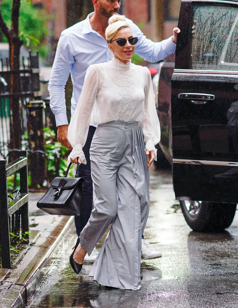 Lady Gaga's high-waist pants are statement-making, and the perfect counter to her romantic top.