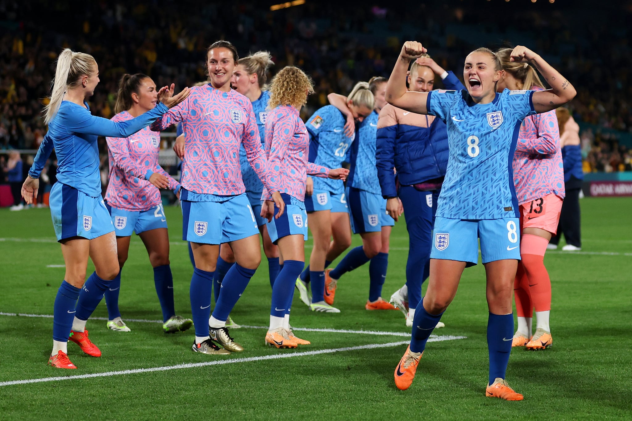 SYDNEY, AUSTRALIA - AUGUST 16: Georgia Stanway and England players celebrate after the team's 3-1 victory and advance to the final following the FIFA Women's World Cup Australia & New Zealand 2023 Semi Final match between Australia and England at Stadium Australia on August 16, 2023 in Sydney, Australia. (Photo by Catherine Ivill/Getty Images)