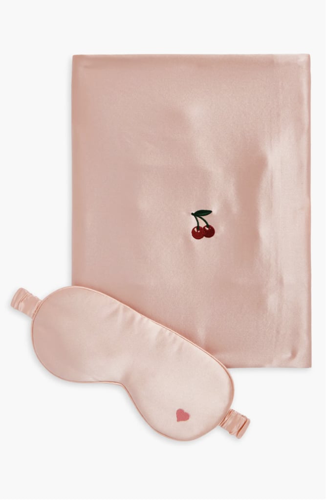 Lost Pattern Embroidered Satin Pillowcase & Sleep Mask Set ($75, originally $125)
For those who take their beauty sleep very seriously, you'll appreciate this plush sleep mask and pillowcase from Lost Pattern. Made from pure silk, the sleep mask gently blocks out light without any extra tugging on your skin, while the pillowcase helps to prevent frizzy hair. If you have lash extensions or want to take a nap without ruining your eye makeup, you'll appreciate the contoured shape of this sleep mask.