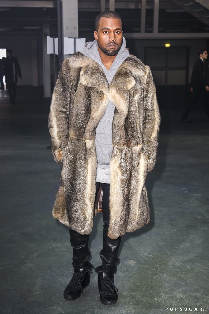 Kanye West rocked a fur coat at Paris Fashion Week on Friday.