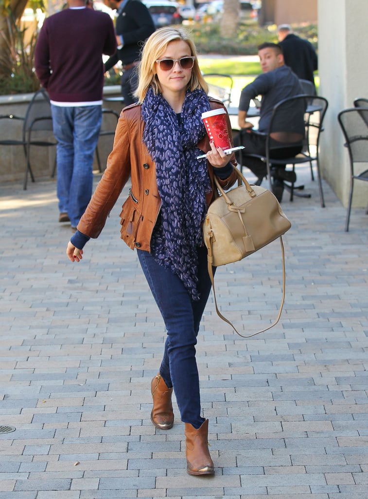 The This Means War star mixed textures to keep her tan-and-navy palette from looking boring. She topped her denim with a ruffled 3.1 Phillip Lim leather jacket, gold-toe Golden Goose boots, and a versatile Saint Laurent bag.