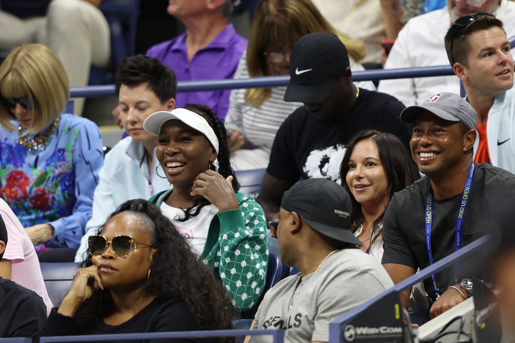 Venus Williams (middle row left, in green) with Erica Herman and Tiger Woods (middle row, far right) at the US Open on Aug. 31.