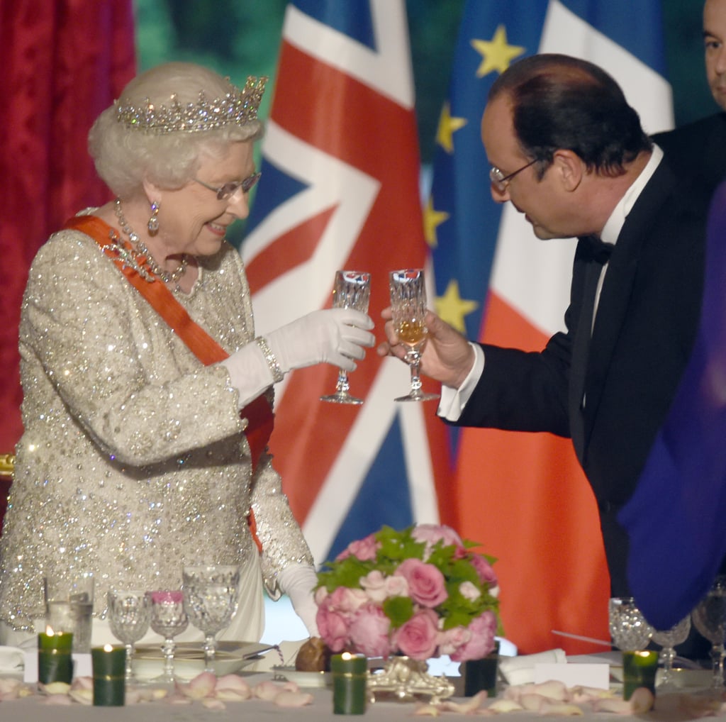 Queen Elizabeth II and French President Francois Hollande share a toast in 2014