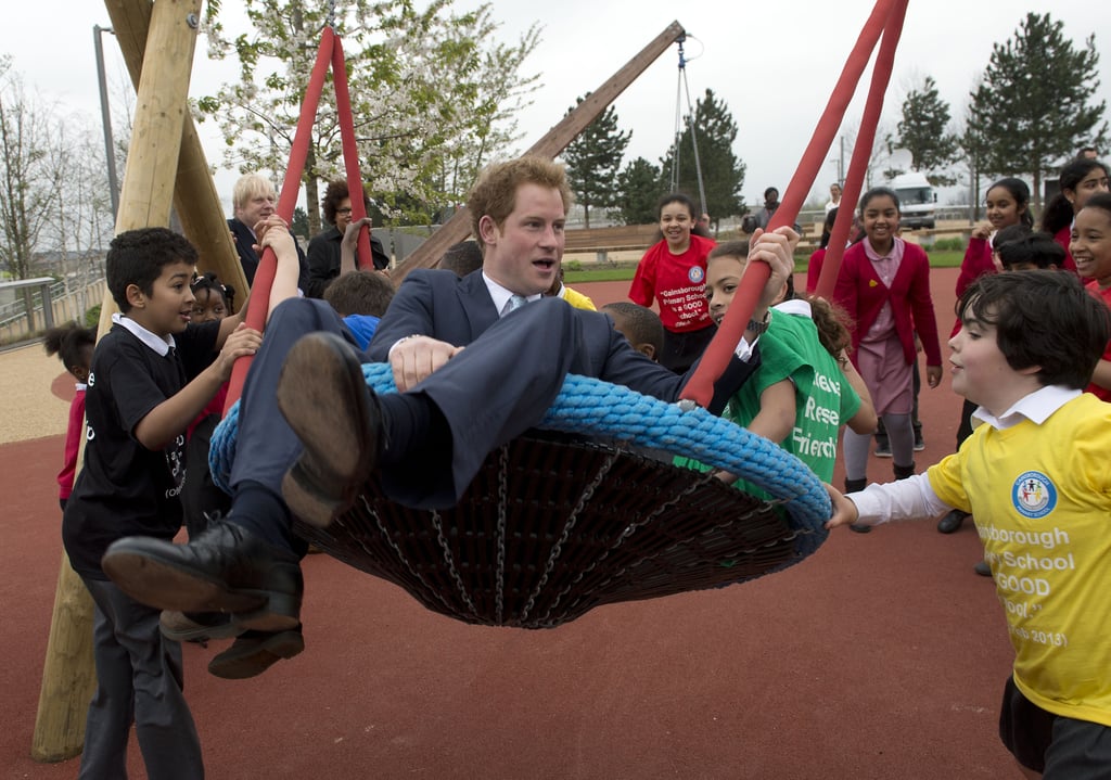 Prince Harry played with children during a visit to the Queen Elizabeth Olympic Park in London on Friday.