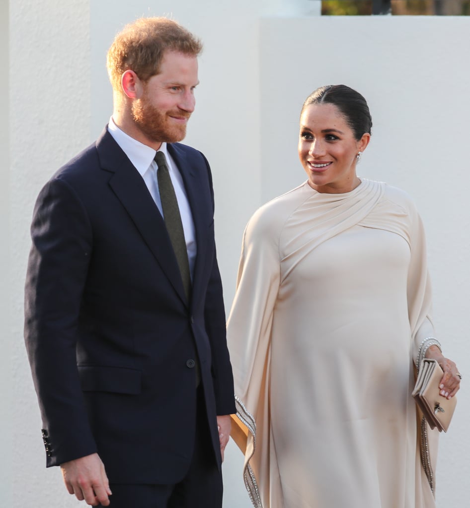Meghan Markle Looking at Prince Harry Pictures