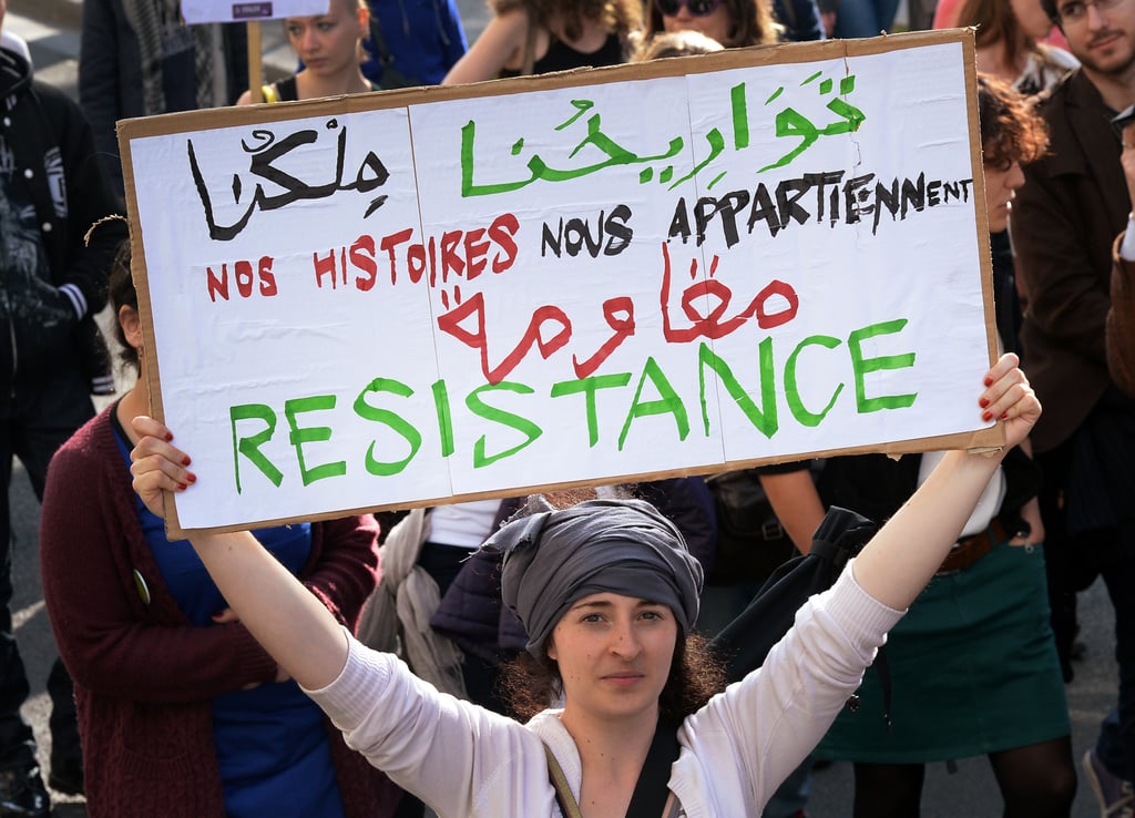 A woman held up a sign during a march in Paris.