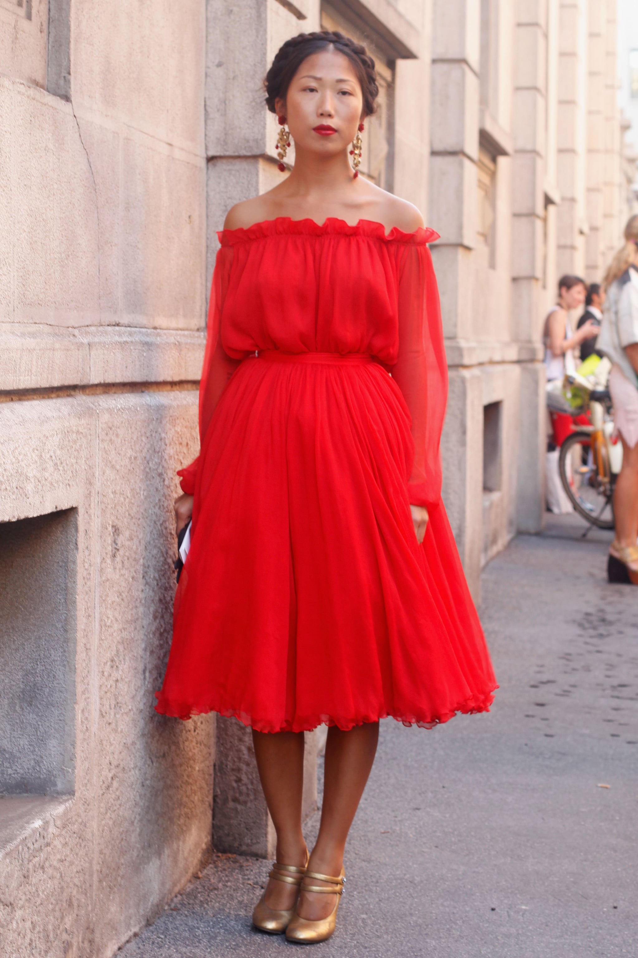 A romantic red off-the-shoulder dress ...