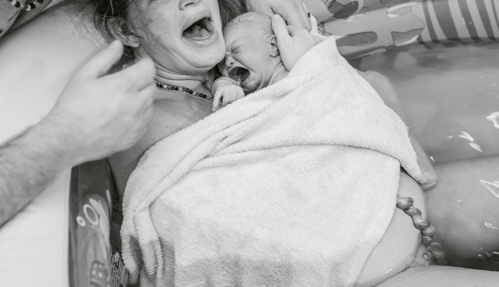Mom Breastfeeding During Childbirth