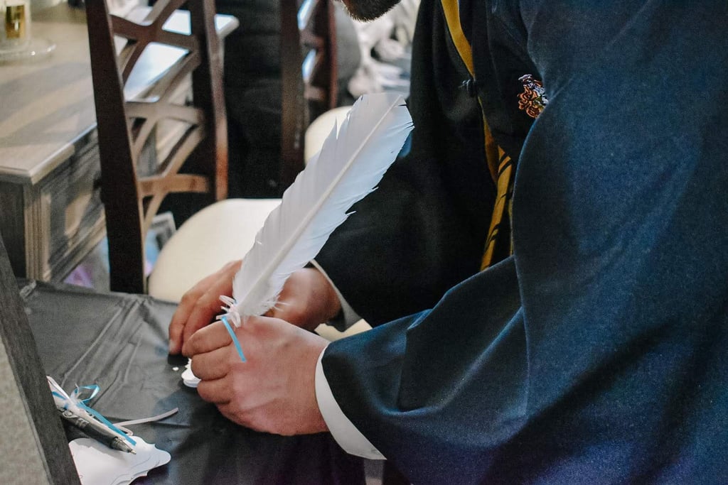 Participants Wrote Their Names on Raffle Slips With Handmade Feather Quill Pens