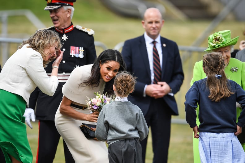 Meghan Receiving Flowers From Children 2018