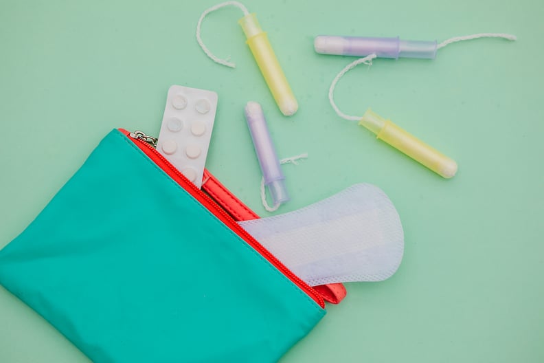 pouch with period products to represent how to delay your period
